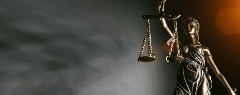 Statue of lady justice on bright background - Side view with cop